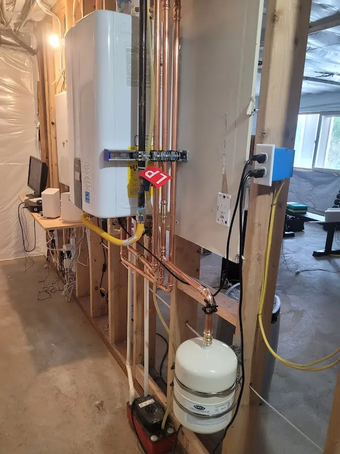 Licensed plumber repairing a kitchen sink in Pratt